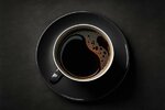 the-perfect-coffee-in-a-black-coffee-mug-against-a-charcoal-background-photo.jpg