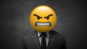 businessman-with-furious-emoji-for-a-face-staring-intently-photo.jpg
